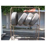 TIRE RACK WITH 4 TOYOTA TIRES & RIMS