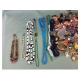 1 BAG WITH MIXED JEWELRY BRACELETS,NECKLACES,PINS