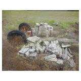 PILE OF CUT STONE AND AXLE