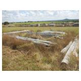 PILE OF POLES &  LUMBER