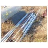 PILE OF CHAIN LINK FENCE POSTS