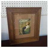 Antique oak-framed print girl with bird