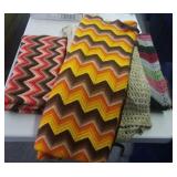 4 hand-crocheted afghans.