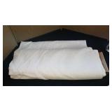 Bolt of white fabric