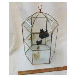 Display case with miniature dogs