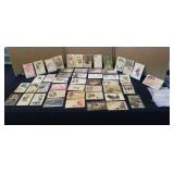48 vintage postcards in protective sleeves