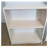 2 small white shelf units