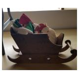 Wooden sleigh with Christmas towels