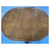 Medium colored wooden drop leaf table