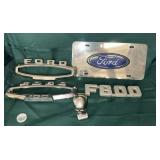 An arrangement of ford emblems and a skull