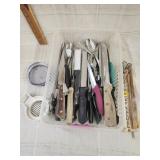 Lots of skewers , knives, forks & spoons,