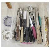 Lots of skewers , knives, forks & spoons,