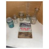 Vintage signs and mason jars with a milk bottle