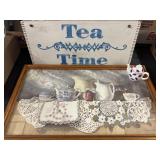 Tea time sign and tiny teacup and a painting by