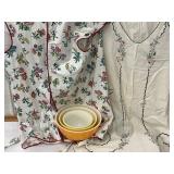 Two aprons and a Pyrex ball set of three mixing