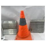 Two wheel chocks and a collapsible safety cone