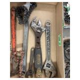 Three adjustable wrenches, two pipe chain wrenches