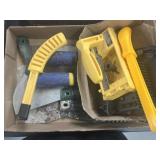 Dog tail, gauge trowels and grout folks
