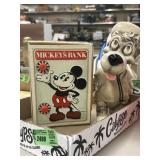 Mickeyï¿½s bank and a small dog baseball player