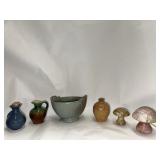 Stoneware jugs and stone mushrooms