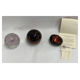 Paperweights and a hand lacquered river rock f