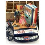 A Pepsi phone with dancing figurines, in various