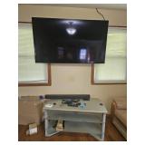Lg Wall mounted TV, Polk sound bar, & tv stand