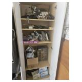 White  cabinet & contents: light bulbs, gloves,