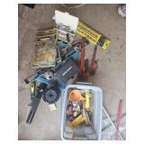 Assorted tools: pipe wrenches, level, sockets