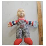 Chucky doll with tags, hair is removed