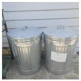 2 metal trash cans