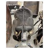 Black Wintec  horse saddle and whip