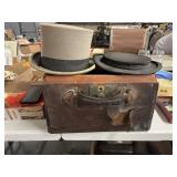 Two vintage top hats one is the Hatter  style a