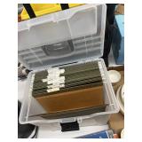 A file box with hanging filing folders inside of