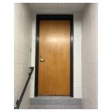 Boys bathroom door leading to stage