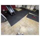 Black rubber matting upstairs