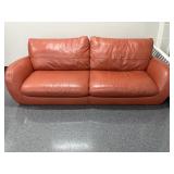 Orange leather couch in room 305