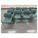 Nine green cushioned chairs