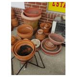 Approximately 30 terra cotta flower pots