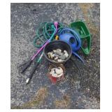 Hoses, seeder, landscape rocks
