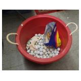 Bucket of golf balls, covers, tees, grips
