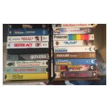 Approx 24 VHS tapes and holder