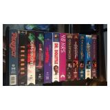 Approx 24 VHS movies and organizer