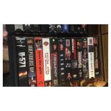 Approx 24 VHS movies and holder