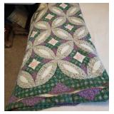 Green, purple,  & pink bedspread