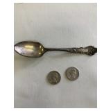2 silver quarters and spoon