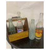 Coke crate with 4 early bottles