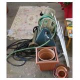 Gardening lot: hose, reel, flower pots, trellis