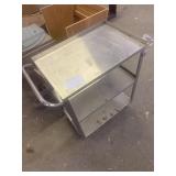 Metal serving cabinet on wheels