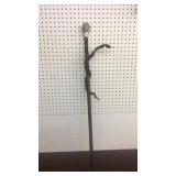 Skull topped with snake walking stick